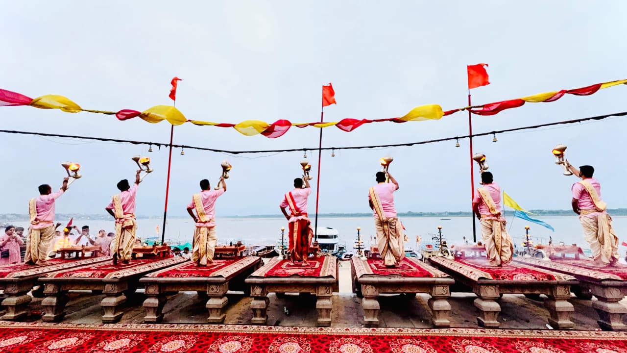 Evening Ganga Aarti ceremony at Dashashwamedh Ghat Evening Ganga Aarti with brass lamps and priests