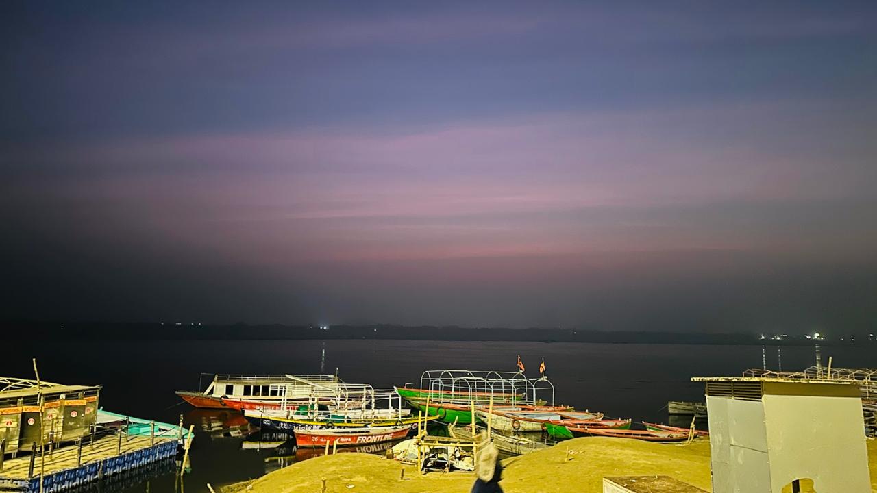 Evening sky over Varanasi ghats during festival Evening ghat illuminated
